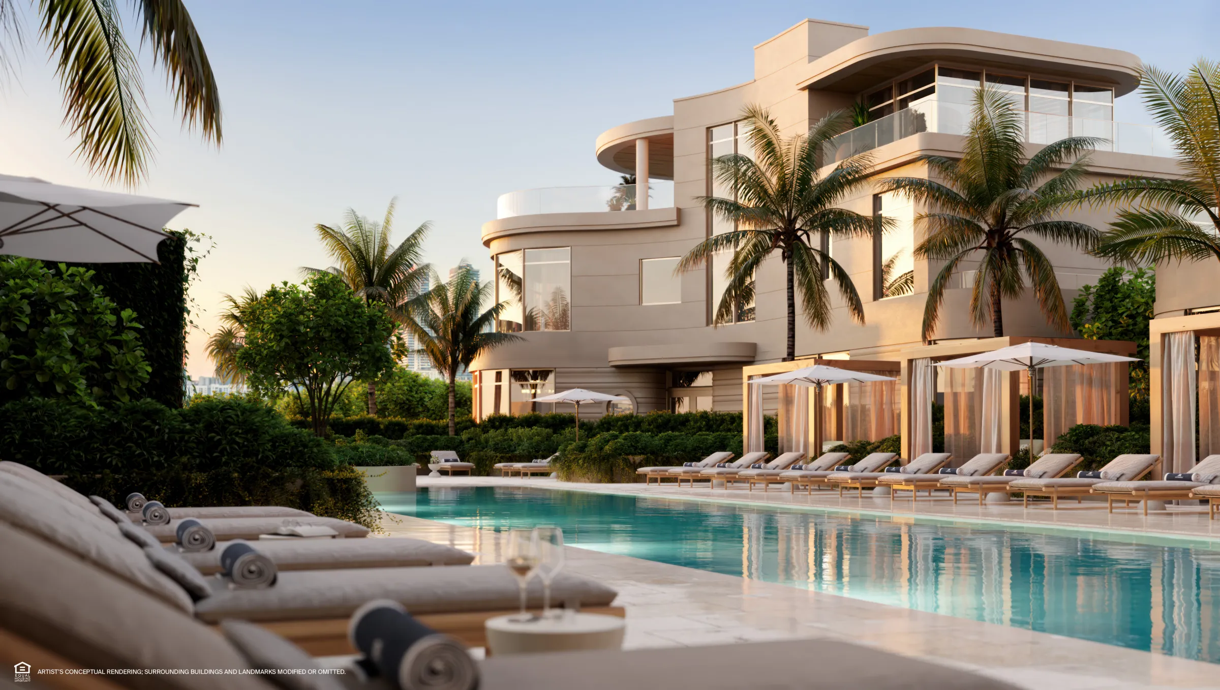 Bayfront pool deck with palms at sunset